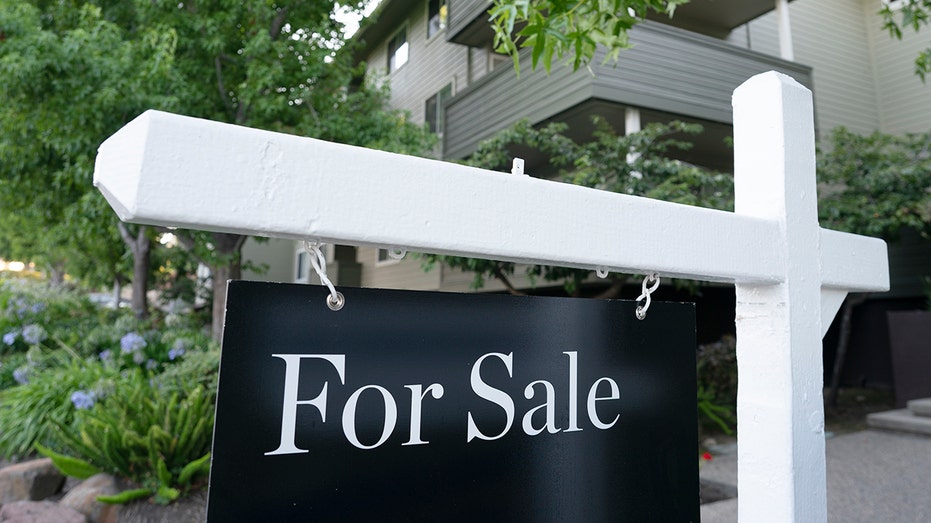 For sale sign in front of home