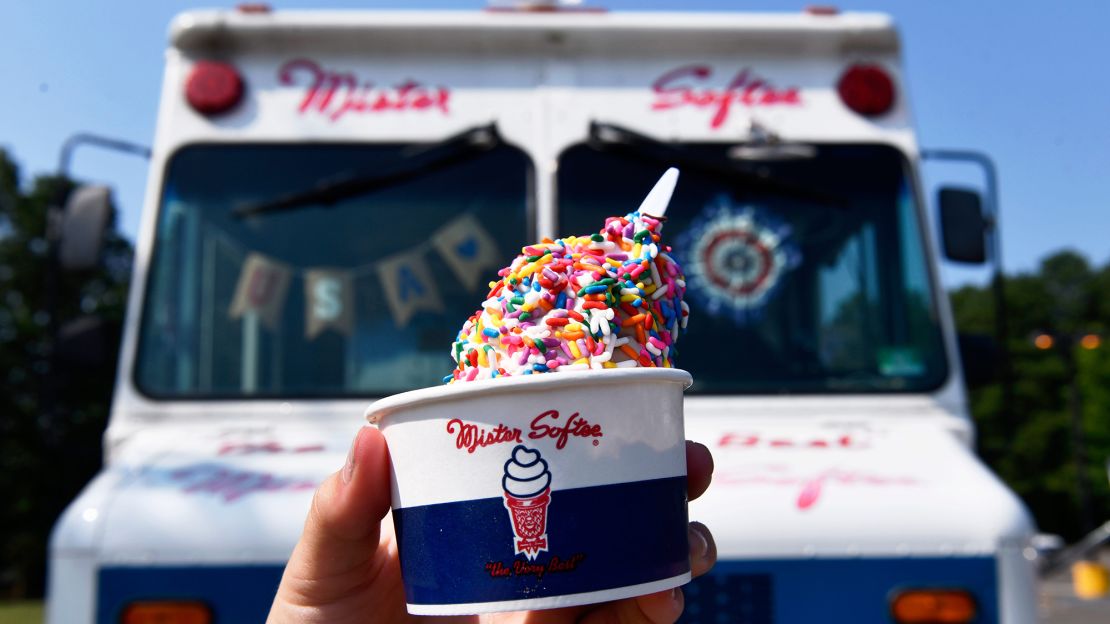 A freshly made cup of Mister Softee ice cream is displayed during a bicycle safety event held in Evesham Township, New Jersey, in 2024.